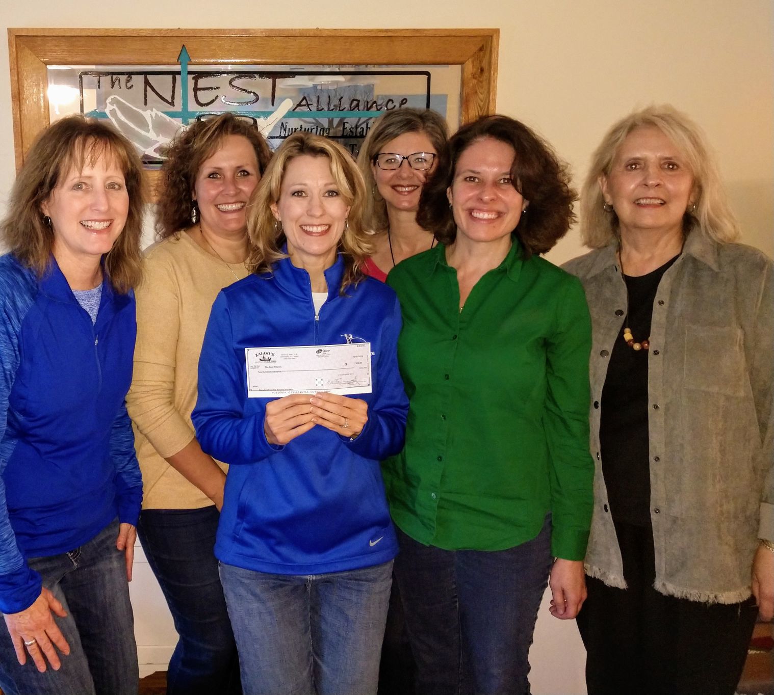 Zaloo's Canoes presents check to NEST Alliance